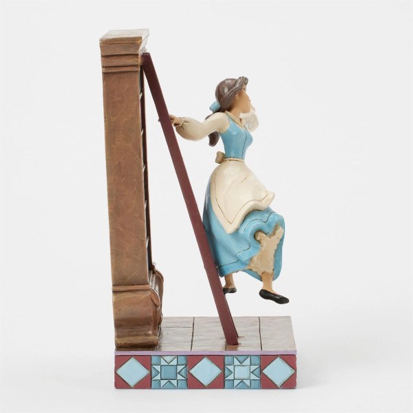 Belle dans sa bibliothèque – Disney Traditions
