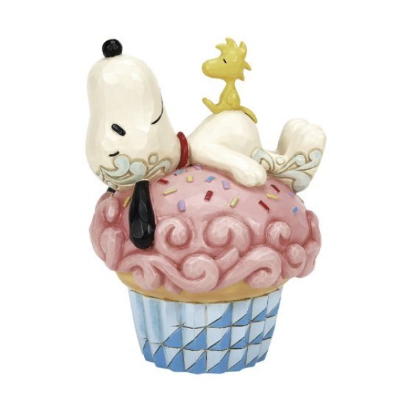 Snoopy allongé sur un cupcake - Peanuts