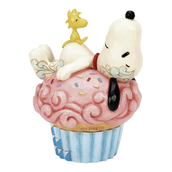 Snoopy allongé sur un cupcake - Peanuts