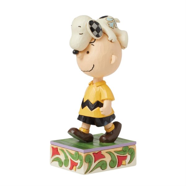 Snoopy sur la tête de Charlie Brown - Peanuts