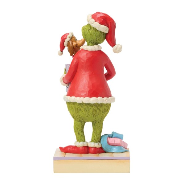 Le Grinch tenant un cadeau - JIM SHORE GRINCH